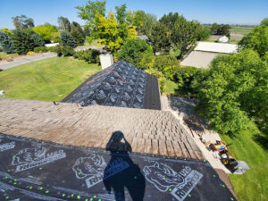 Roof with most of its shingles removed during a reroofing project in Twin Falls, ID.