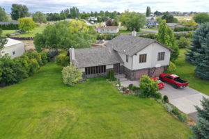 Aerial view of a house undergoing a reroofing project in Twin Falls, ID.