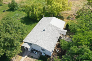 Alternate aerial overview of a house undergoing a reroofing project in Twin Falls, ID.