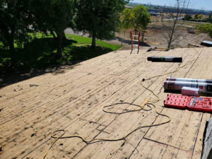 Bare roof deck with all tiles removed as part of a reroofing project in Twin Falls, ID.
