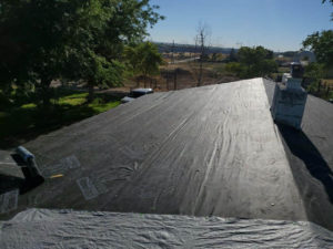View a roof with plastic laid down as part of a reroofing project in Twin Falls, ID.