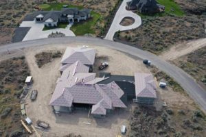 House with roof under construction in roofing construction project in Twin Falls, Idaho.