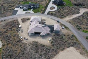 Aerial overview of a roof being constructed on a new house during a roof construction project in Twin Falls, Idaho.