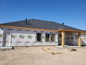 House under construction with a completed new roof in Twin Falls, Idaho.